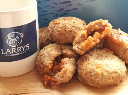 The Beano next to a Larry's Fishcakes mug