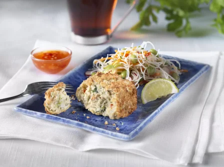 Thai fishcake on a blue plate.