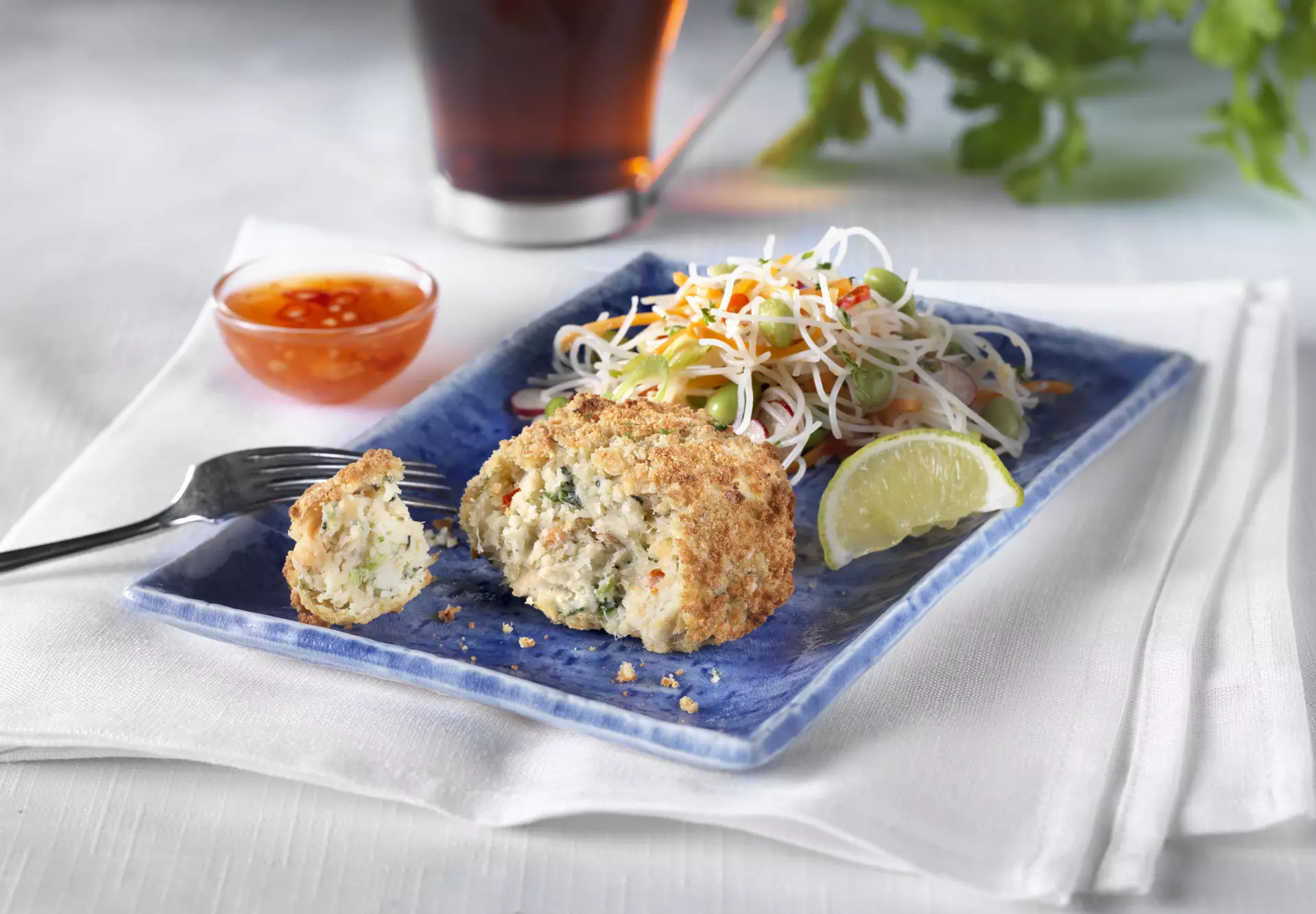 Thai fishcake on a blue plate.
